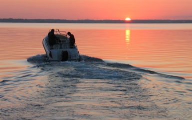 Speedboat sails into the sunset